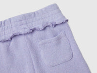 Calças skinny fit em mistura de algodão reciclado - ucb_image_DS1