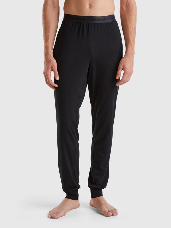 Trousers with elastic logo Men