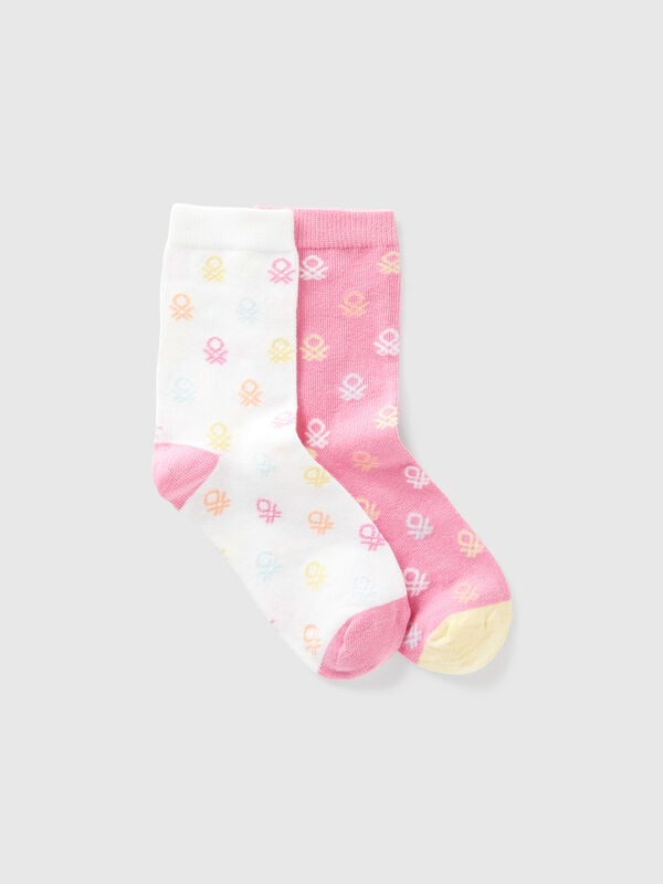 Two pairs of socks with pink and white logos Junior Boy