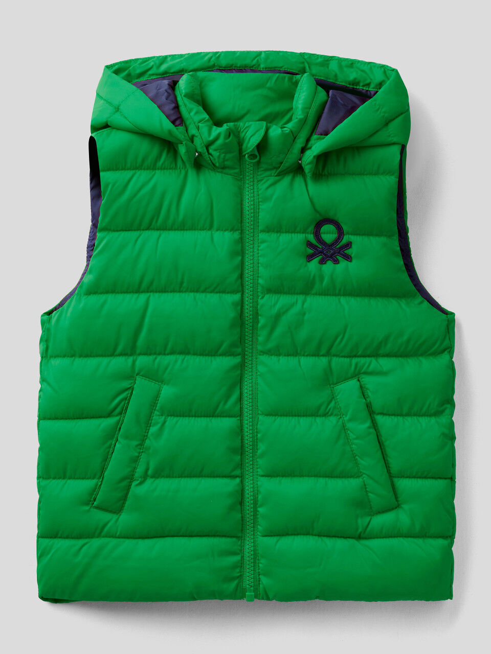 Padded vest with removable hood